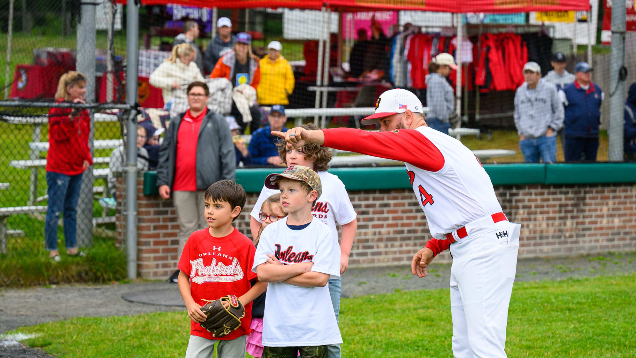 Firebirds coach directs children during a youth clinic.