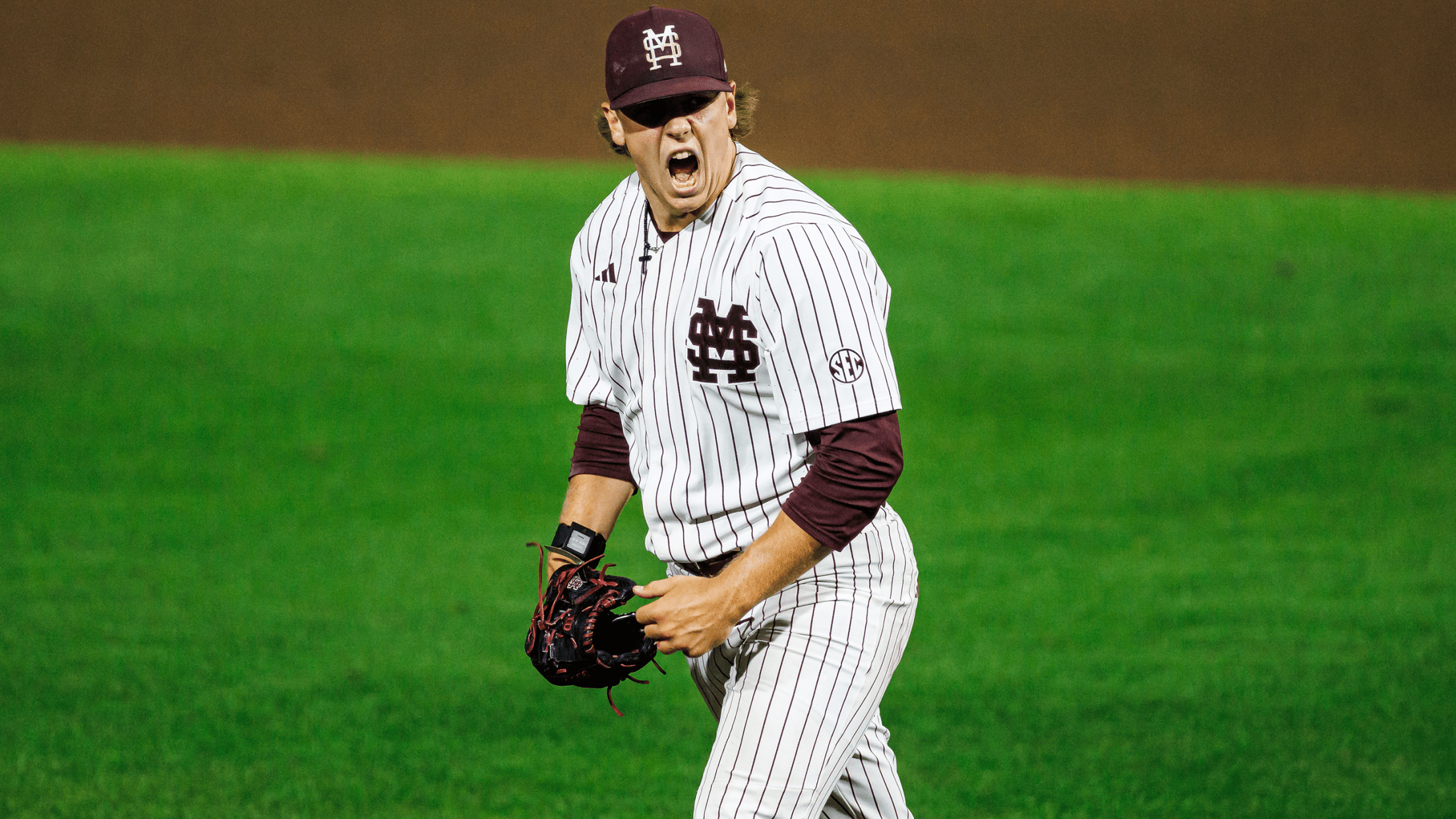 Mississippi State pitcher Tomas Valincius yells in celebration after recording an out