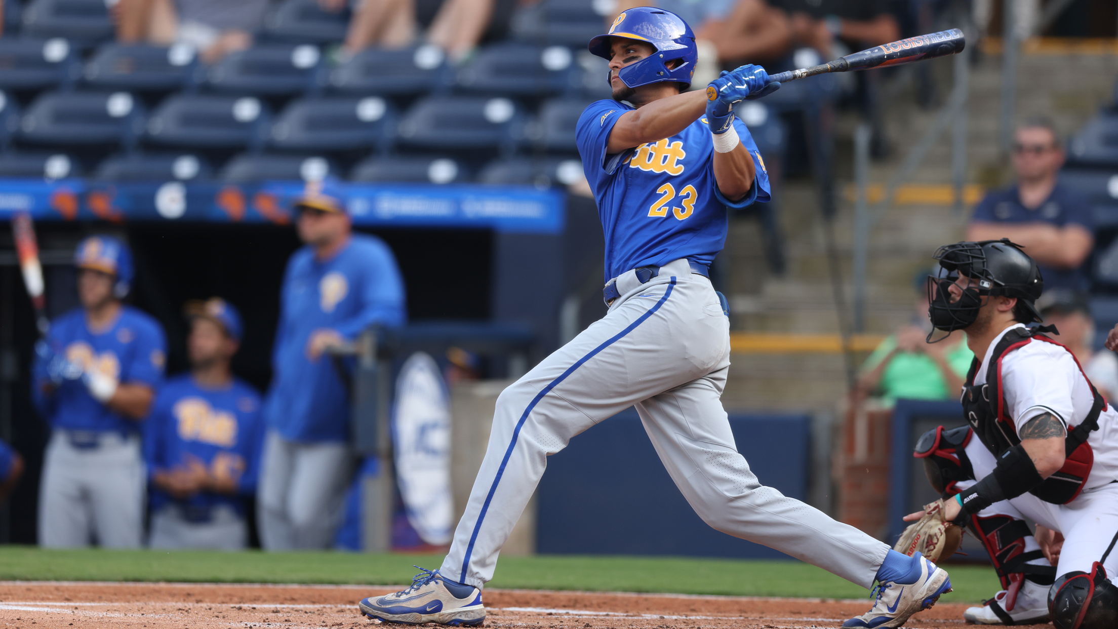 Headshot of Pittsburgh outfielder Lorenzo Carrier watches the ball in his follow-through swing.