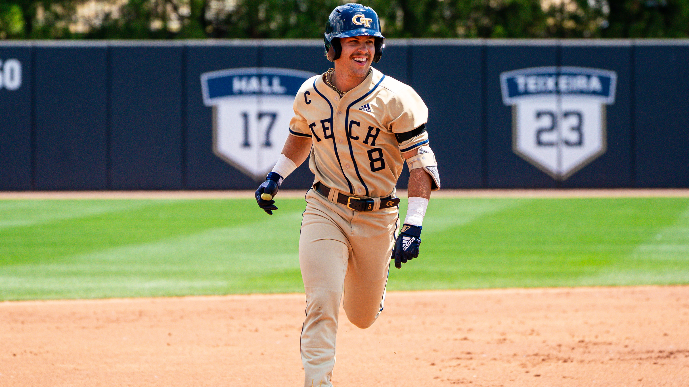 Georgia Tech outfielder Drew Burress is all smiles as he rounds the bases after a home run.