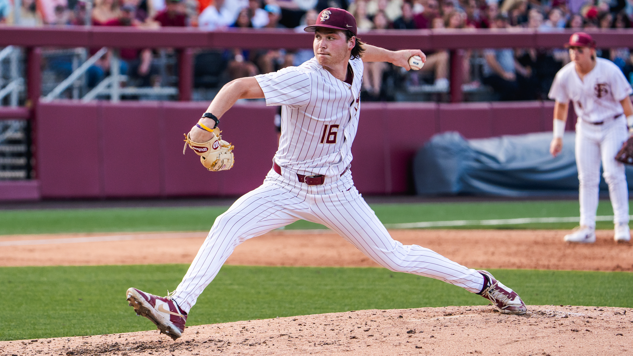 Florida State pitcher Jamie Arnold mid-pitching delivery.