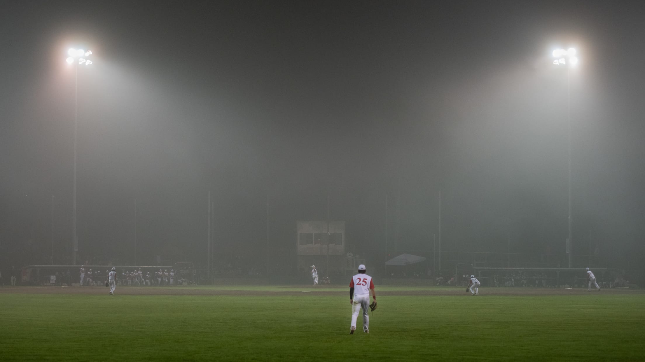 Eldredge Park during a game with the view in from beyond the outfield.