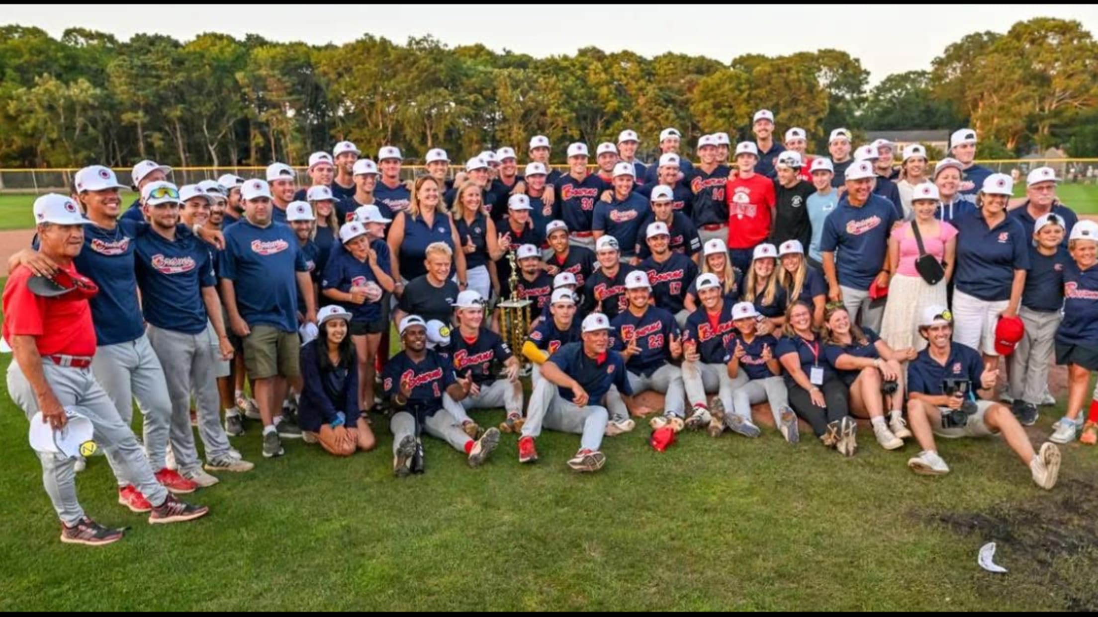 The Bourne team and staffers pose for a photo on the field.