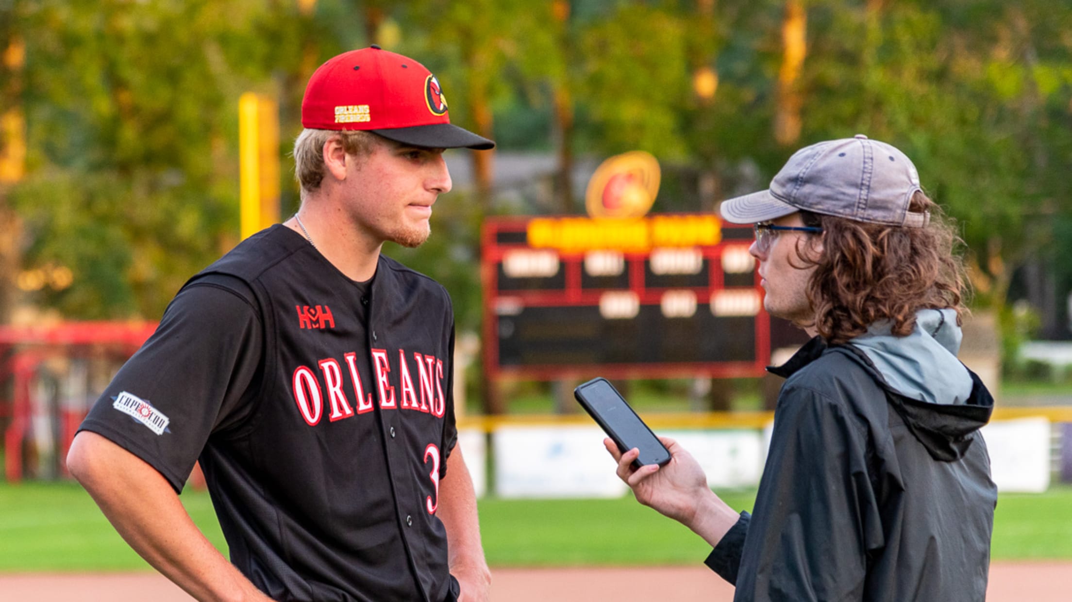 Firebirds intern interviews a Firebirds player after a game.