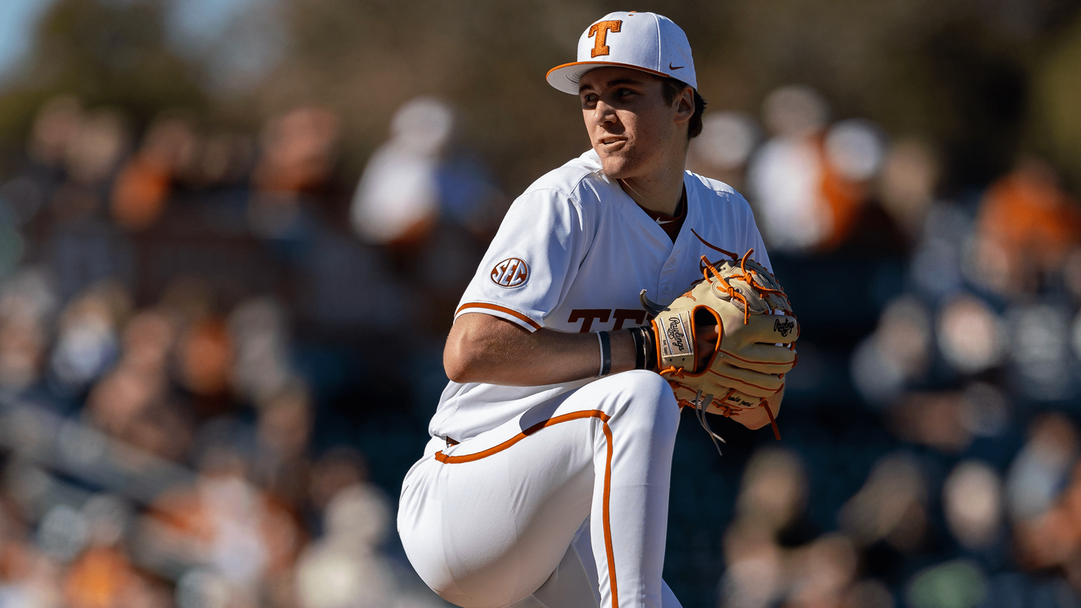 Texas pitcher Dylan Volantis mid-pitching motion