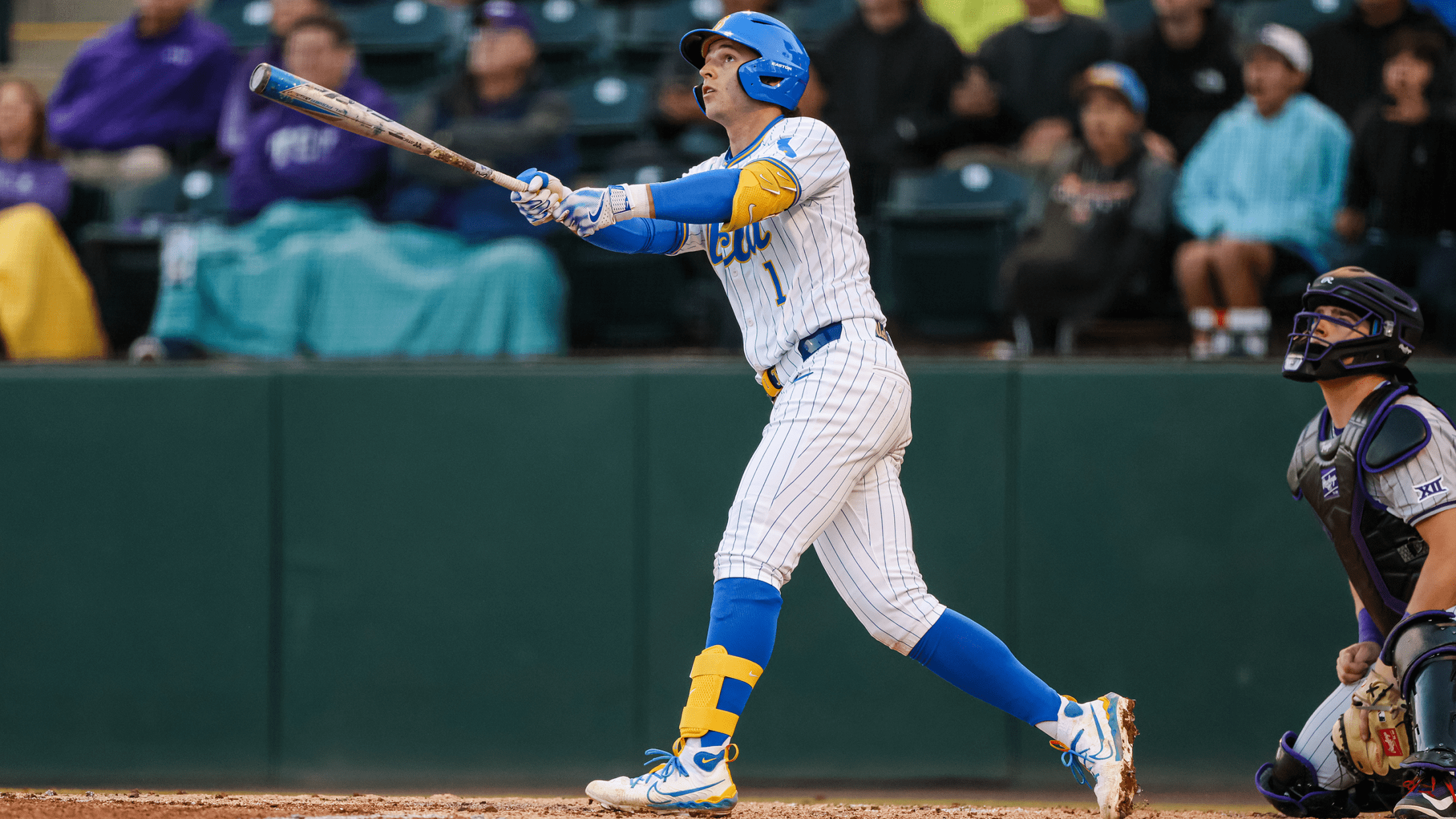 UCLA shortstop Roch Cholowsky holds his follow-through and watches the flight path of his batted ball.