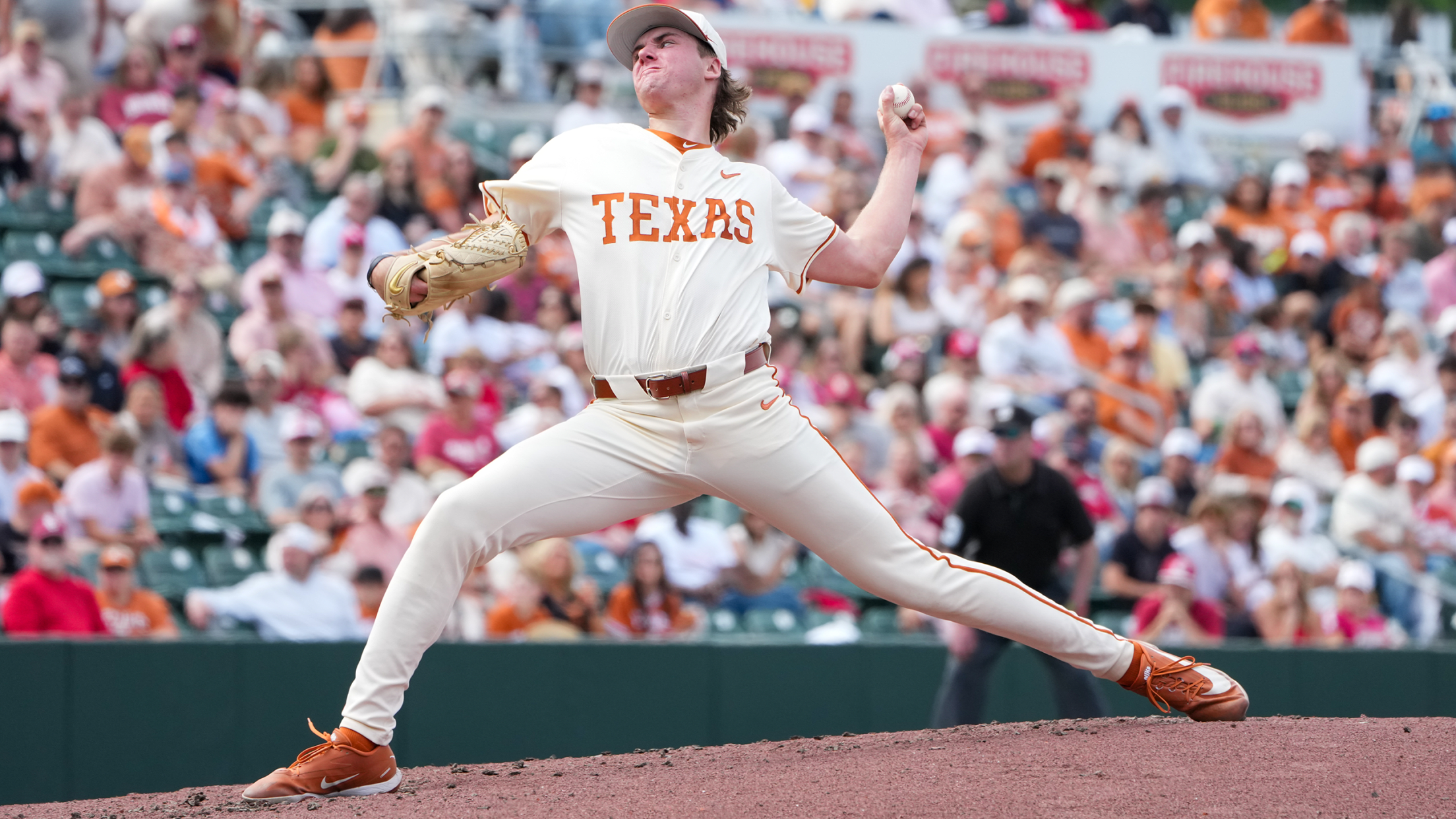 Texas pitcher Dylan Volantis delivers a pitch