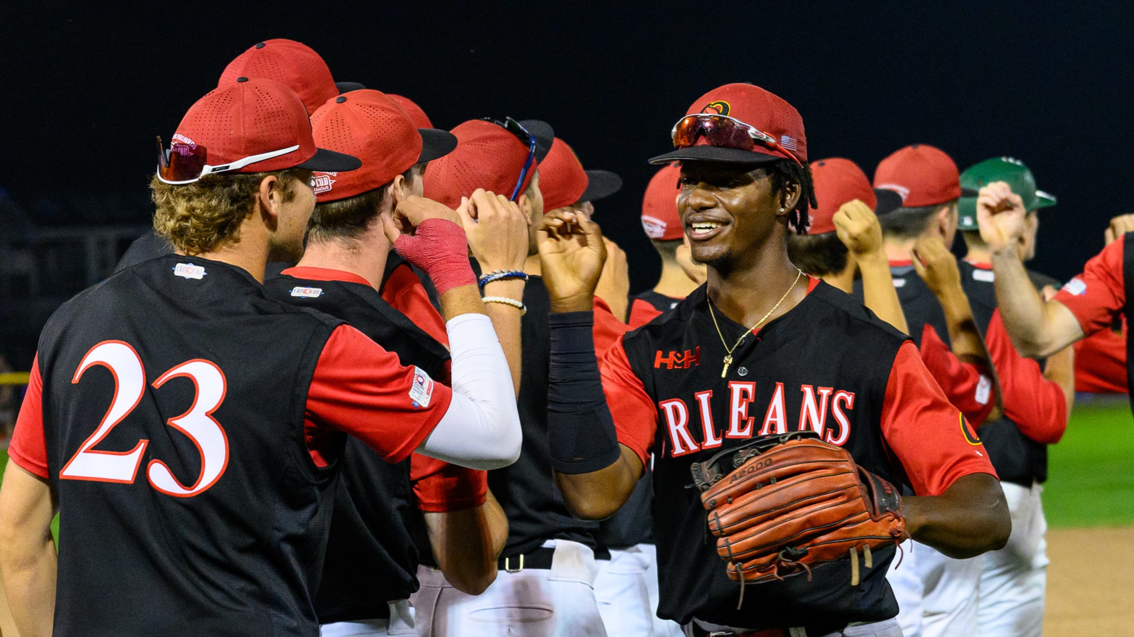 Firebirds players partake in the handshake line after a victory.