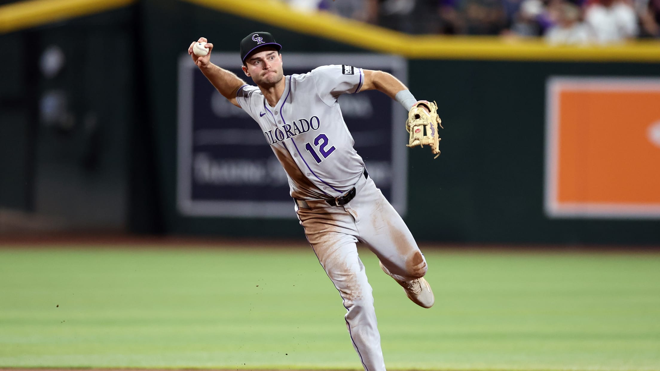Kyles Karros makes a play at third base for the Colorado Rockies while playing at Chase Field in Arizona.