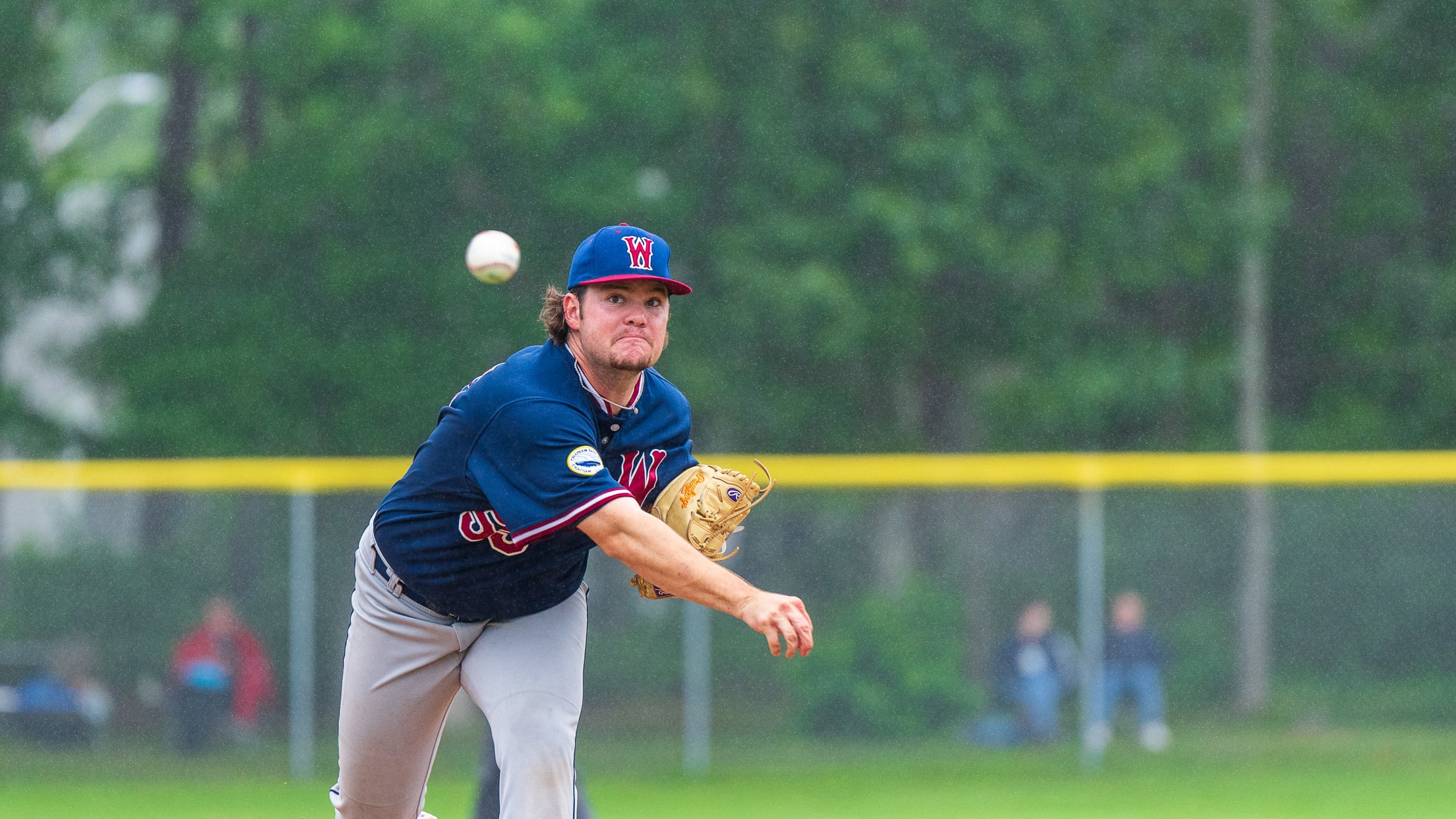 Wareham Gatemen pitcher delivers a ball that is now mid-flight.