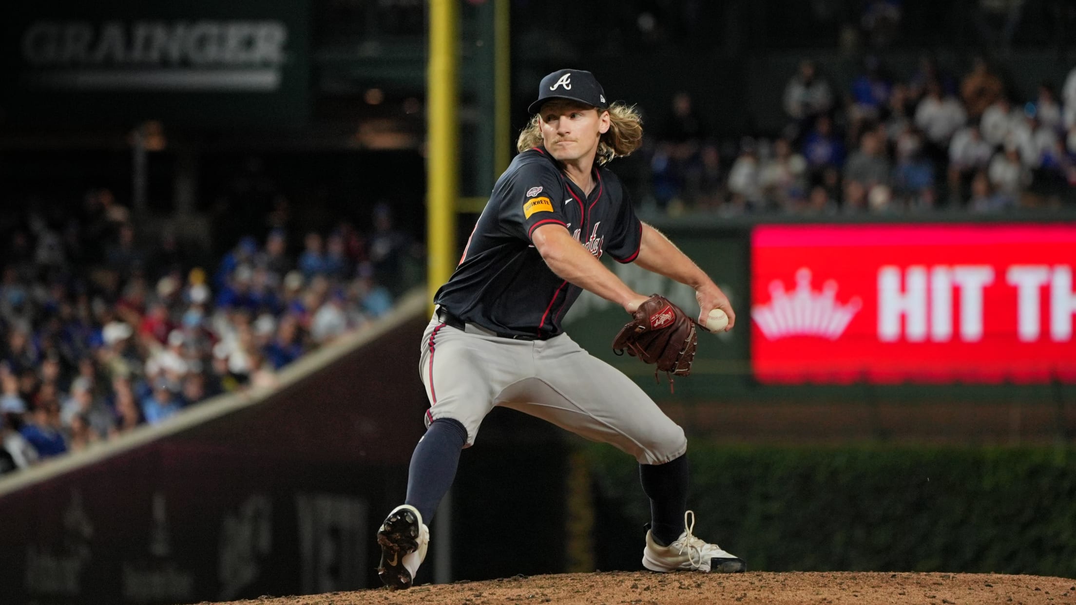 Hayden Harris mid-motion in his MLB debut at Wrigley Field.