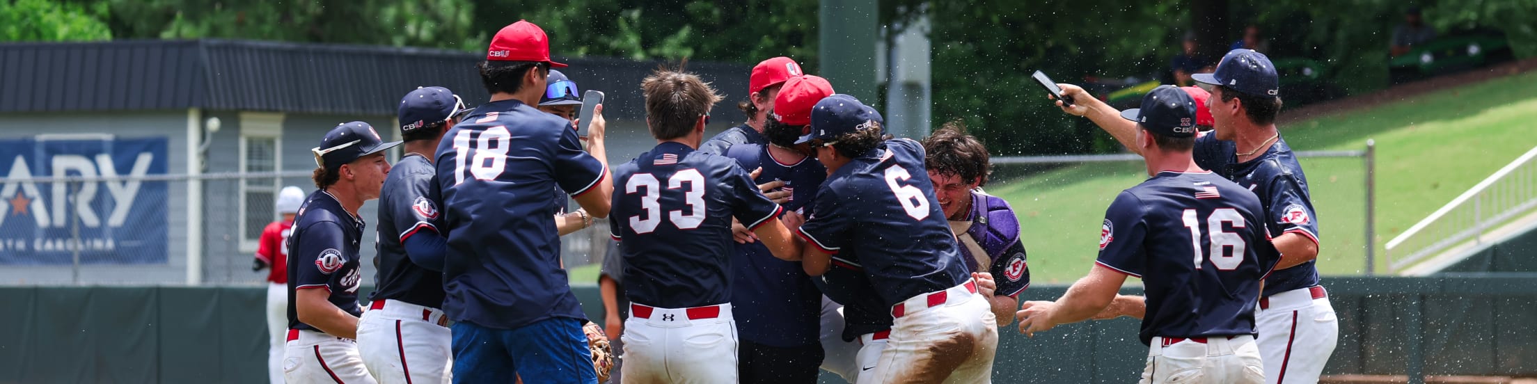 Baseball players celebrating in a huddle