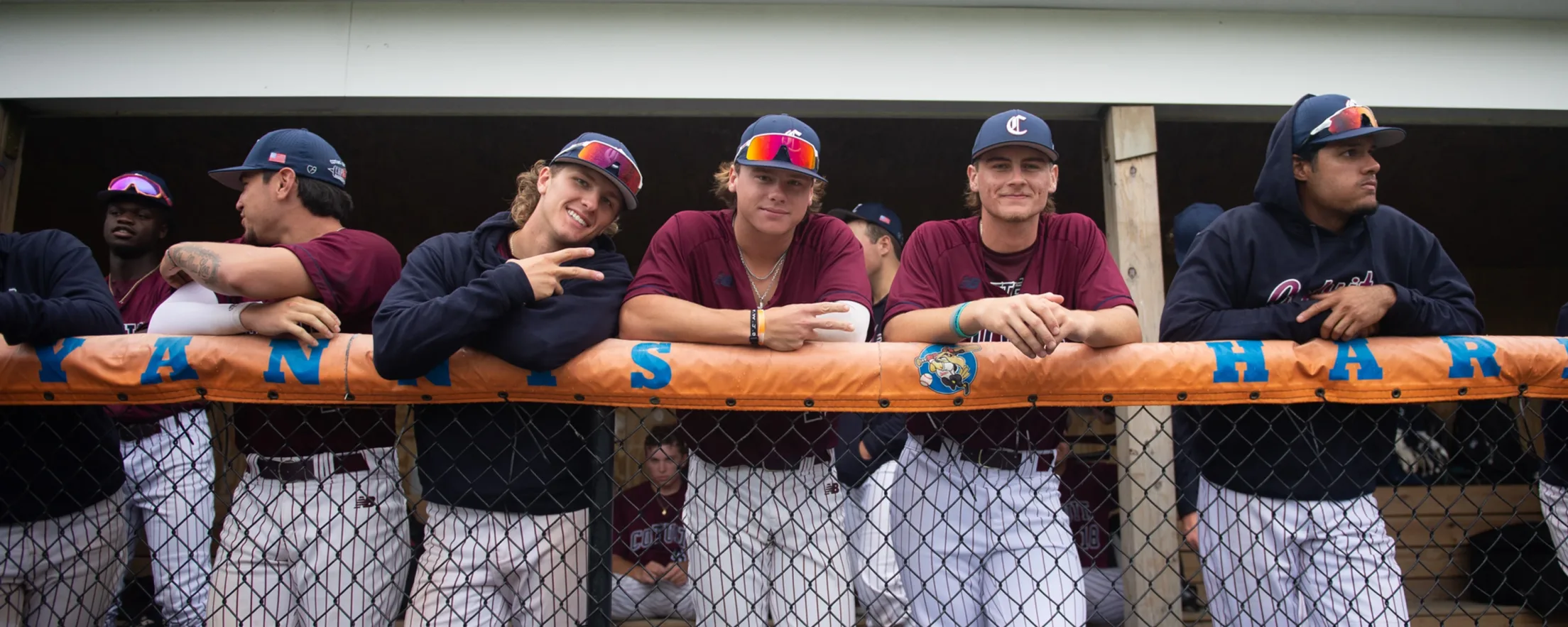 Kettleers players standing the dugout