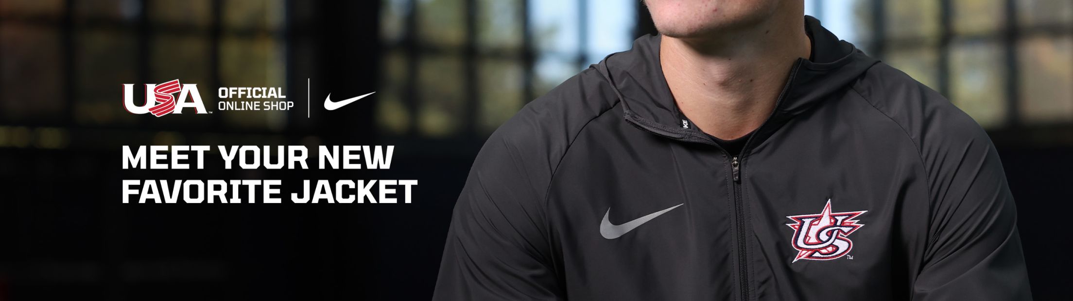 A graphic with text on it that says Meet your new favorite jacket. It also has a person wearing a grey jacket with the USA Baseball logo on it as well