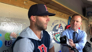 Dustin Pedroia talks to the media before the game