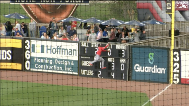 Peoria's Lott leaps into the wall and holds on