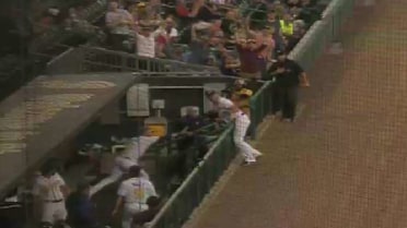 Russell goes full-extension into dugout to make catch