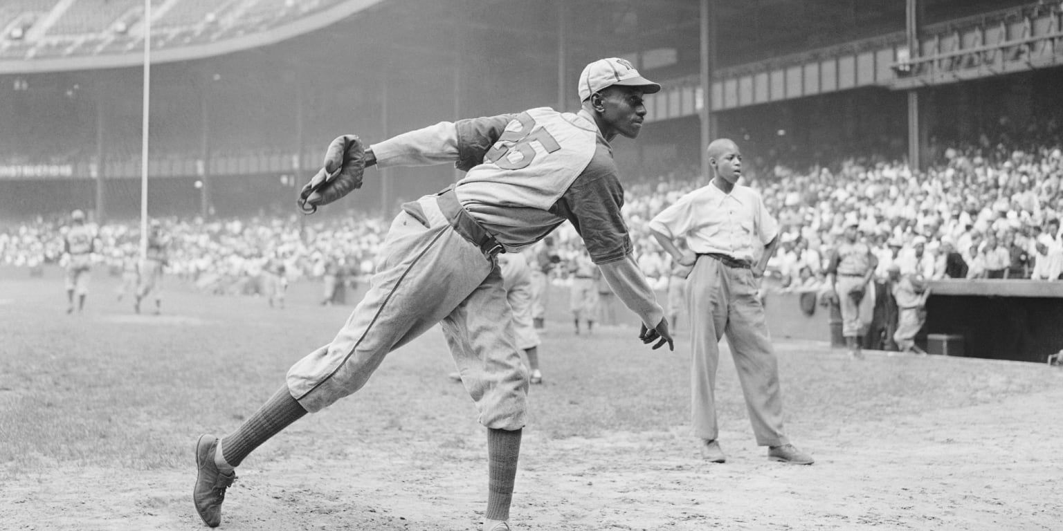 Satchel Paige pitches for A's at age 59