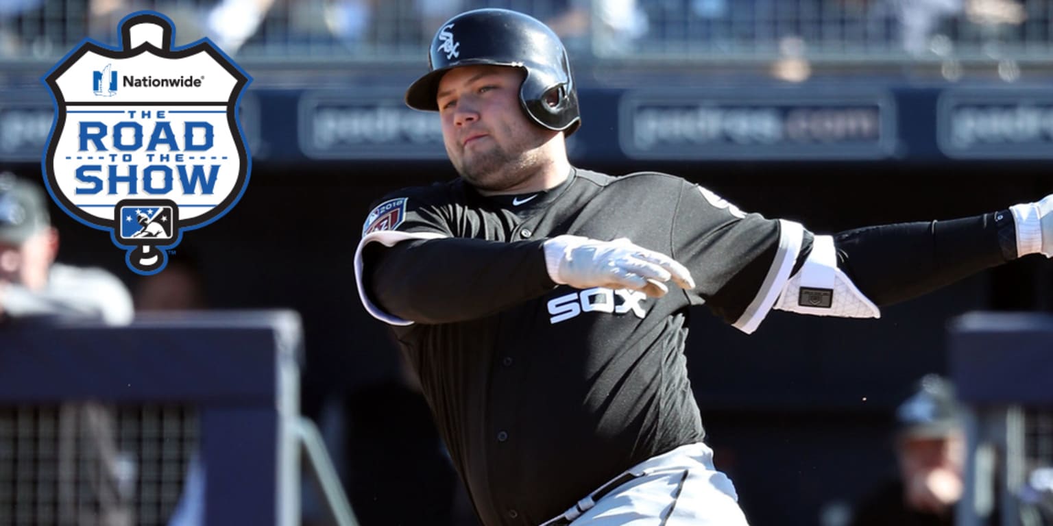 Chicago White Sox's Jake Burger swings at a pitch in a baseball