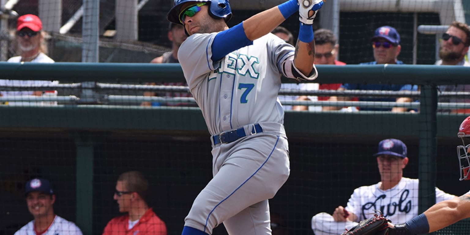 Puerto Rico's Emmanuel Rivera (26) rubs his hair after a hit to center  field during the first inning of a World Baseball Classic game against  Mexico, Friday, March 17, 2023, in Miami.