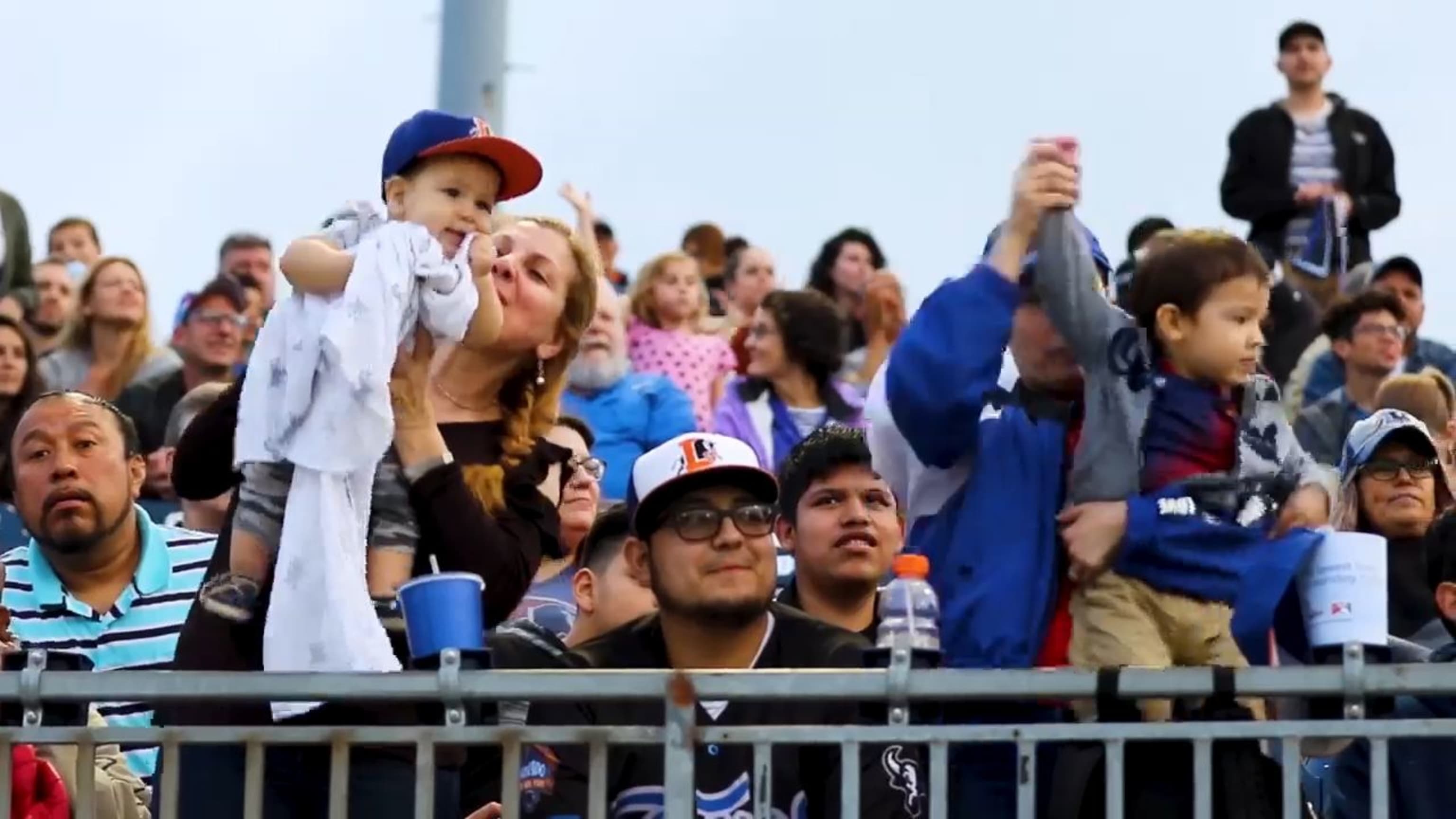 Dodger fans cheering on the Boys in Blue; looking to buy new apparel