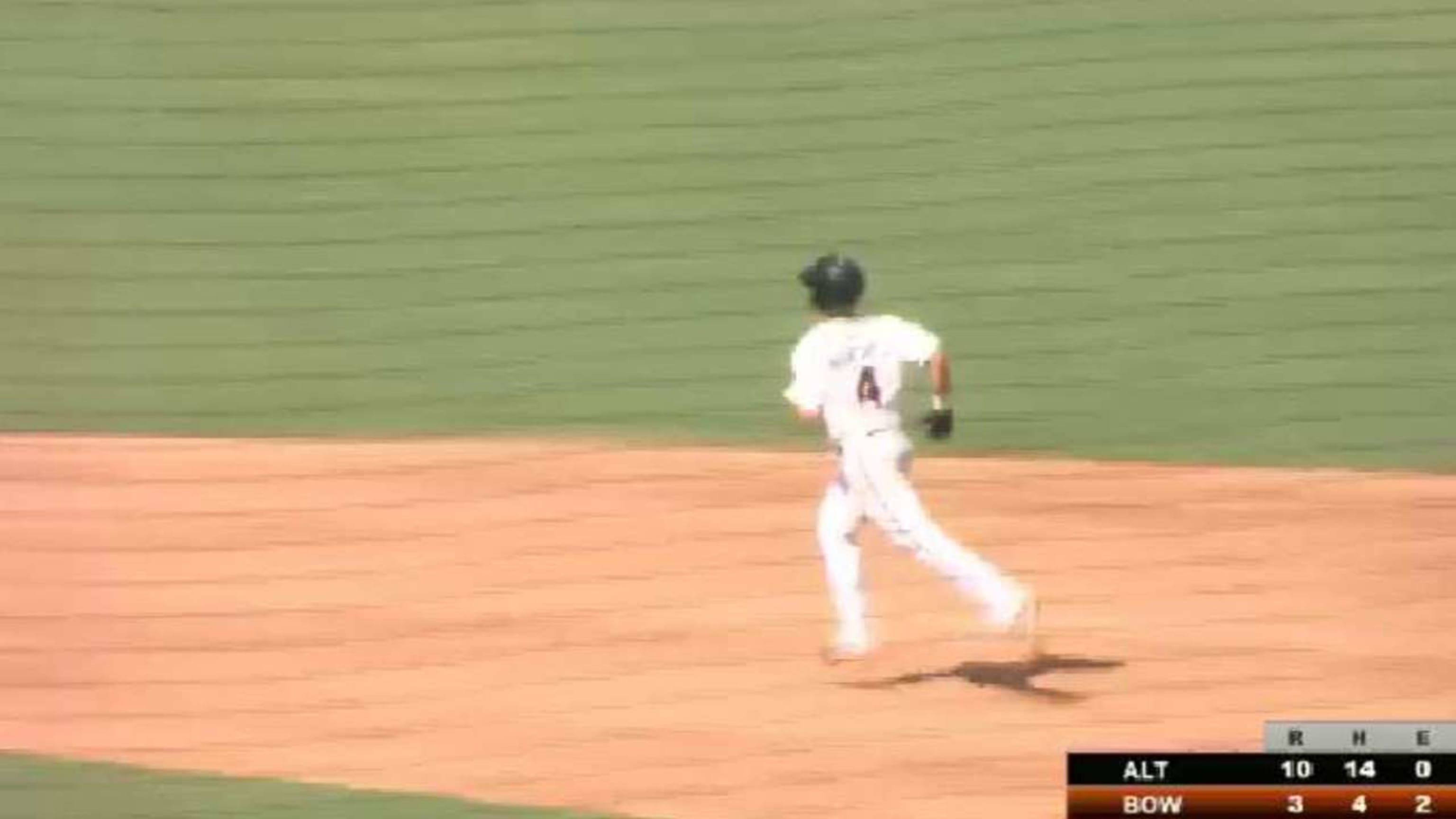 Ryan Mountcastle of the Baltimore Orioles laughs after swinging at