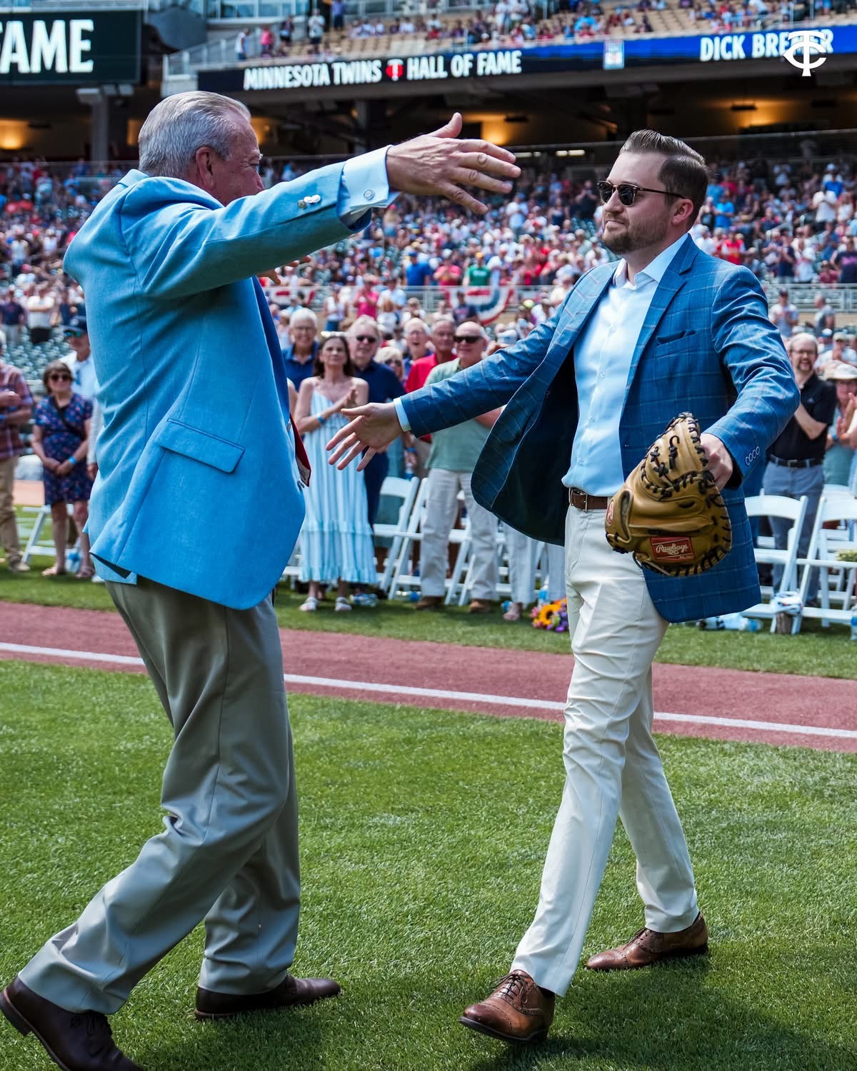 Dick Bremer and Erik Bremer embrace at Saturday's Twins Hall of Fame Induction.