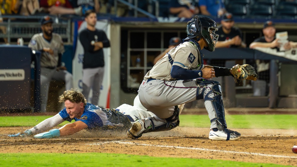 Elijah Hainline slides home safely with one of Tulsa's eight runs in its fifth straight victory on Saturday night at ONEOK Field.