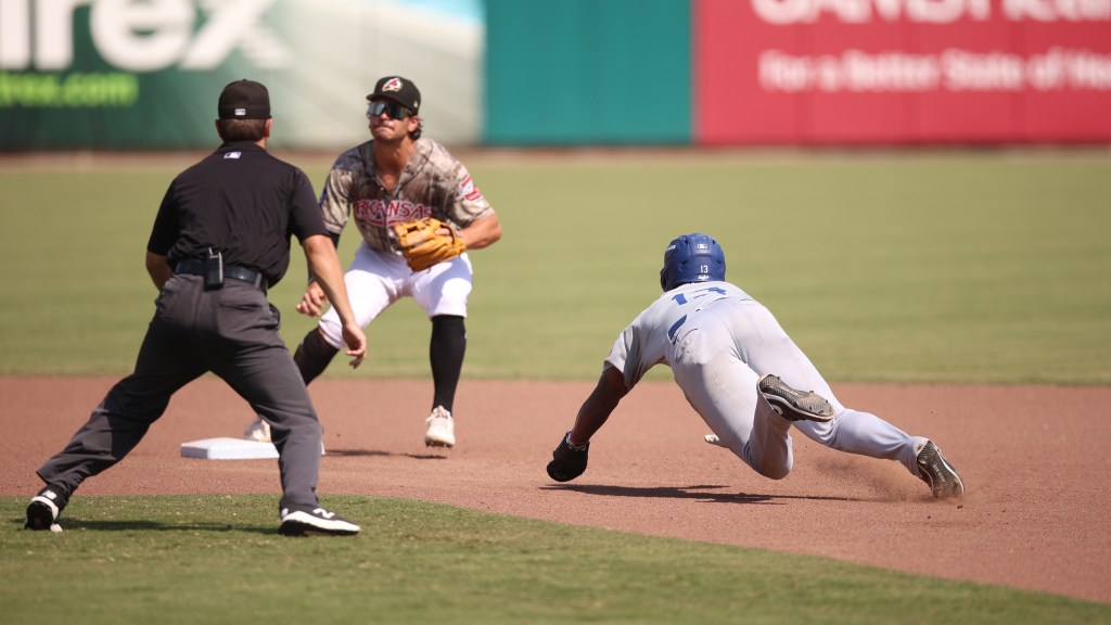 Zyhir Hope slides into second during Sunday's loss in Arkansas.