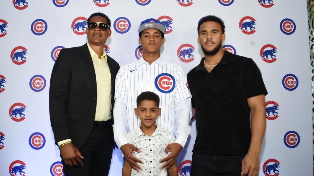 The Figuereo Family, including Dad Victor (left), Breyner (center) and Gleider (right) celebrate Breyner's first professional contract with the Chicago Cubs.