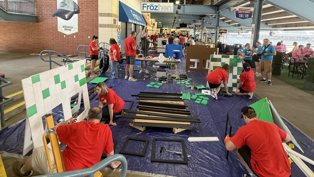 Local organizations build playhouses at Fifth Third Field for Maumee Valley Habitat for Humanity's Project Playhouse.