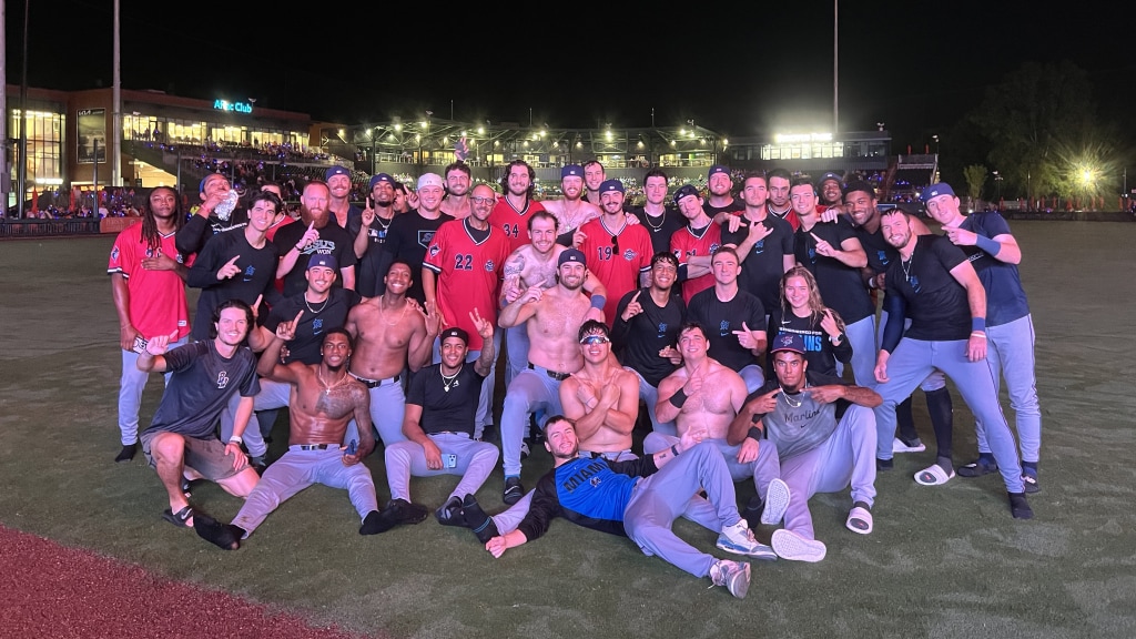 The Blue Wahoos celebrate their second half South Division title on Sunday night in Columbus.
