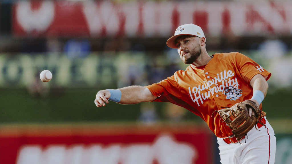 Garrett Hampson hurls a ball to first on Humidity Night against Omaha.