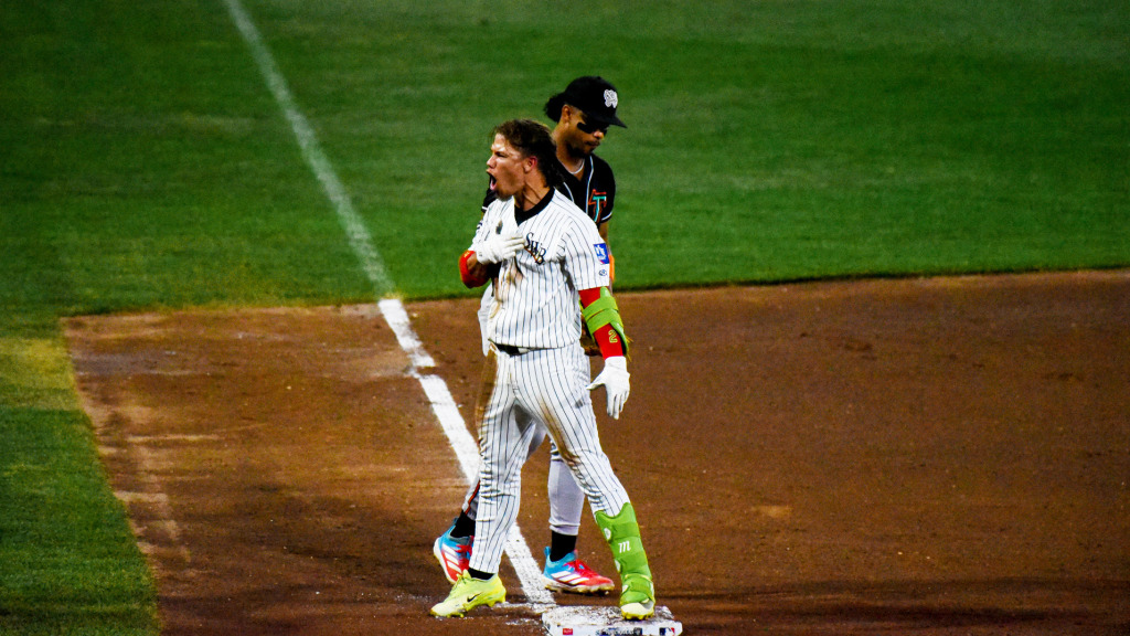 Kenedy Corona races for a triple and scores the go-ahead run on a wild pitch.