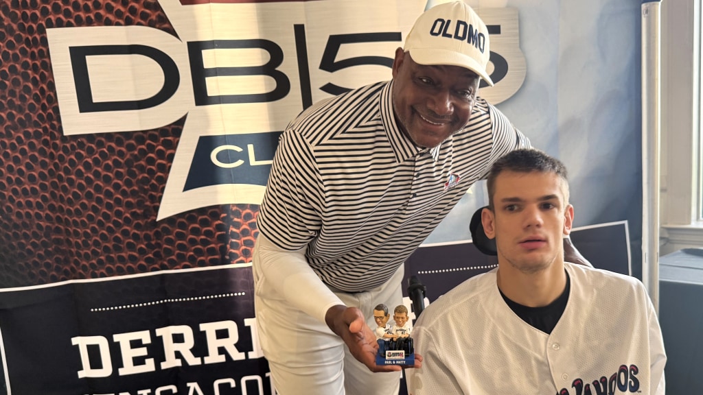 Blue Wahoos investor Derrick Brooks joins with Matthew Chestnutt, special needs son of Fox Sports Pensacola broadcaster Paul Chestnutt on August 17 prior to the Derrick Brooks Charities Classic at Pensacola Country Club.