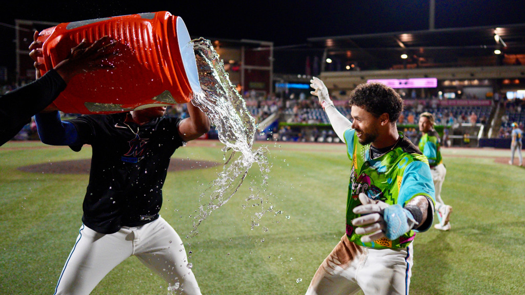 Cristian Hernández celebrates with teammates after his walk-off single on Thursday night.
