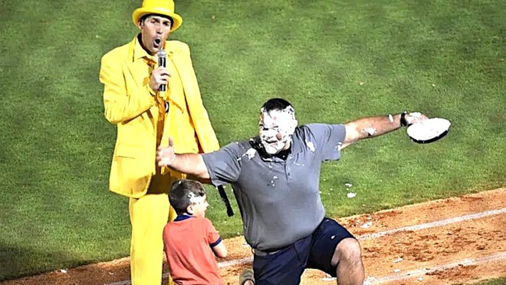 Savannah Bananas founder/CEO Jesse Cole emcees a father getting pied by his son on March 27, 2021 during the Savannah Bananas visit to Hank Aaron Stadium in Mobile.