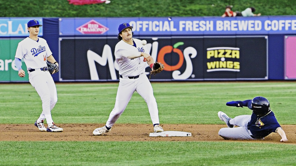 Second baseman Jake Gelof throws to first base to complete a double play during Tulsa's come-from-behind 11-7 victory over Northwest Arkansas on Saturday night.