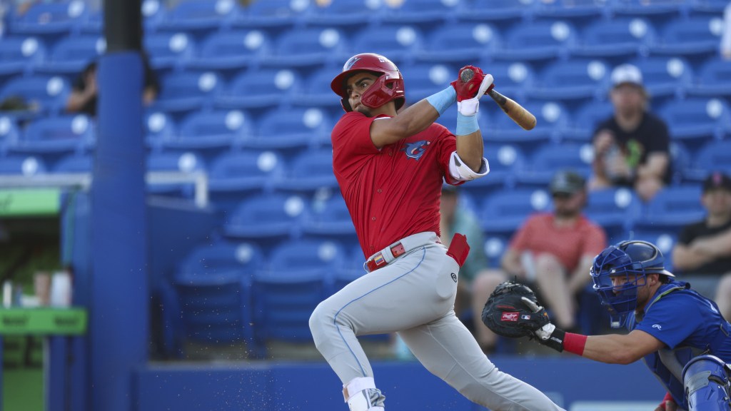 Phillies catching prospect Alirio Ferrebus takes a swing in a Threshes game against Dunedin