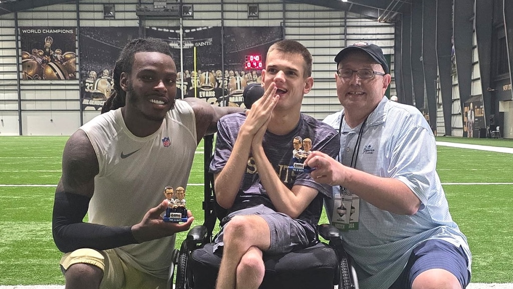 New Orleans Saints cornerback Martin Emerson Jr., a Pine Forest High graduate, visits with Matthew Chestnutt and Paul Chestnutt before a Saints preseason practice in New Orleans.