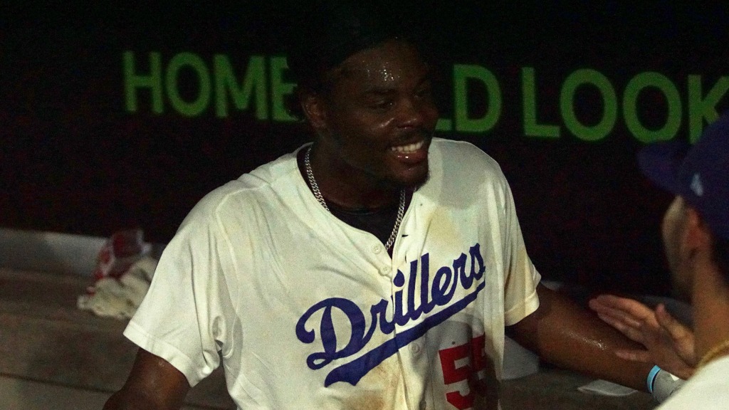Josue De Paula celebrates in the dugout after his game-winning homer and subsequent Gatorade bath.