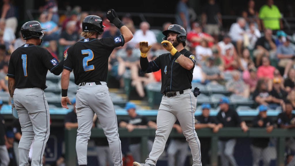 Ryan Cesarini celebrates at home plate after hitting a three-run home run for his second homer of the night and sixth of the series.