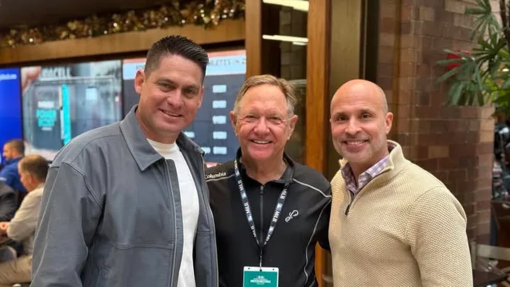 Houston Astros manager Joe Espada, far right, and former New York Mets manager Carlos Mendoza, with Blue Wahoos owner Quint Studer during visit with the two former Pensacola Pelicans players at the 2025 MLB Winter Meetings.