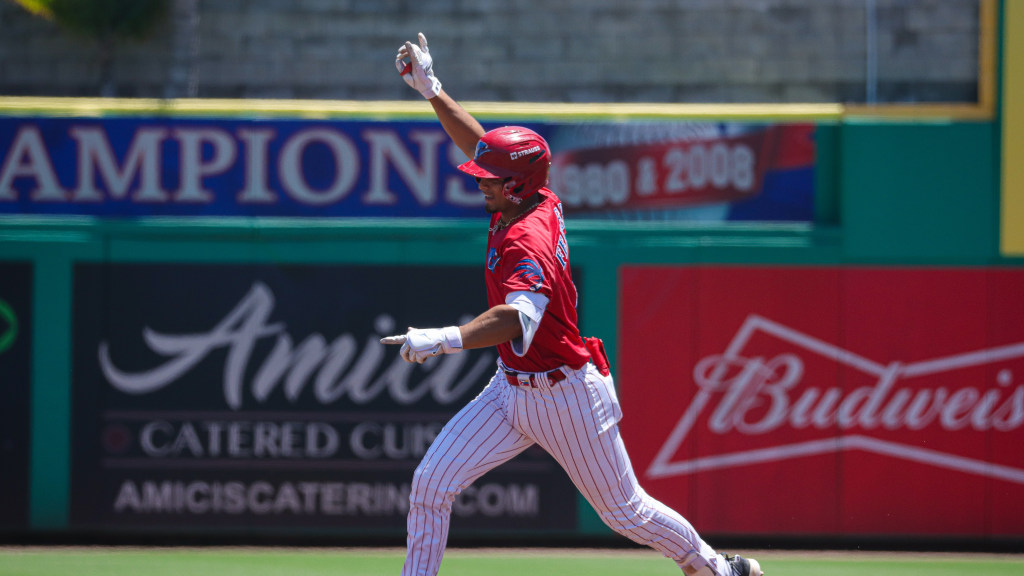 Alirio Ferrebus rounds the bases after a three-run home run for the Threshers