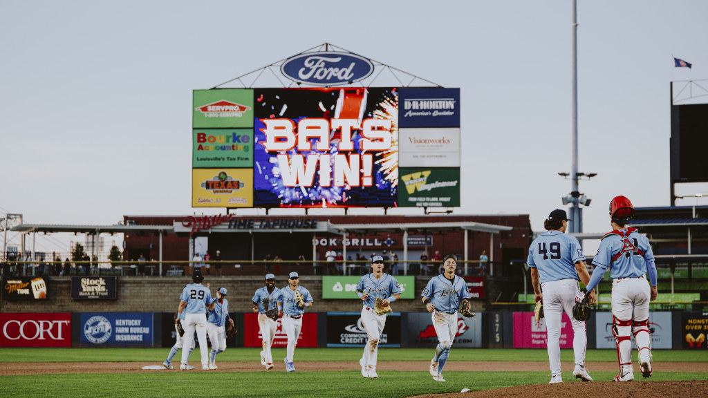 Bats walk to shake hands after a win against St. Paul
