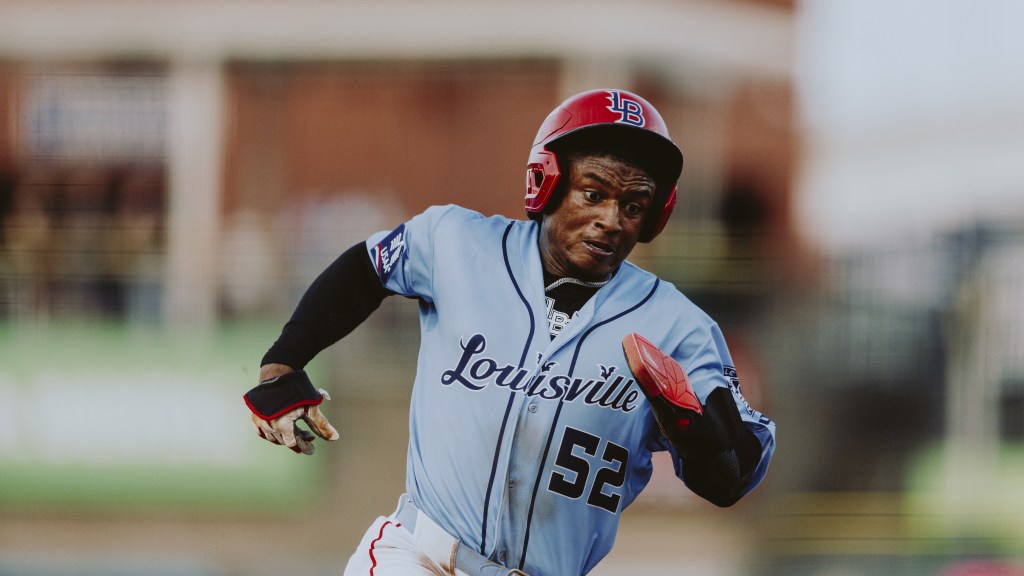 Carlos Jorge rounds third and heads to score against Indianapolis.