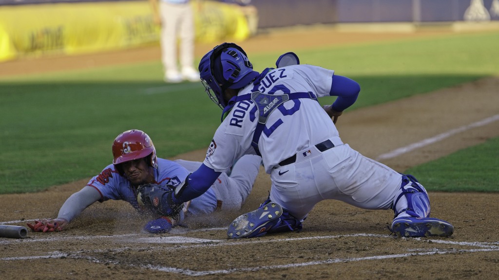 Catcher Frank Rodriguez tags out Deniel Ortiz in the second inning of Tulsa's 7-3 win at ONEOK Field..