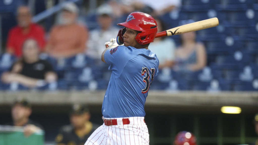 Phillies outfield prospect Manolfi Jimenez takes a swing for the Threshers in a game against Bradenton.