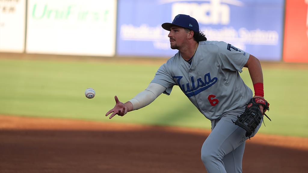 Tulsa first baseman Jake Gelof tosses a throw to first in Tuesday's loss at Midland. At the plate, Gelof had two hits.