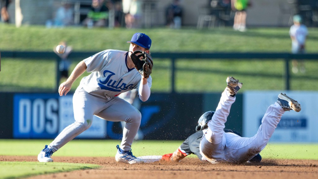 Sean McLain takes a throw at second base during Tulsa's extra-innings loss in Wichita on Sunday night.